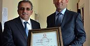 BAKİ TEZCAN MAZBATASINI ALDI..